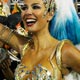 Luciana Gimenez poses with the band of the Imperatriz samba school in Rio de Janeiro