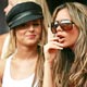 Cheryl Tweedie sits in the stands with Victoria Beckham