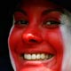 A soccer fan smiles at the opening ceremony of the World Cup 2006 opening ceremony in Munich