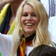 Model Claudia Schiffer waves during the Group A World Cup 2006 soccer match between Germany and Costa Rica in Munich