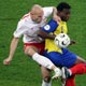 Sobolewski battles for the ball with Ecuador's Tenorio