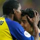 Delgado kisses his team mate Kaviedes after Delgado scored goal in Gelsenkirchen