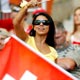 A fan waves a flag in the stands before the match between France and Switzerland in Stuttgart