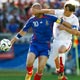 Zinedine Zidane and Johann Vogel fight for the ball in Stuttgart