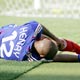 Henry lies on the pitch during the Group G World Cup 2006 soccer match against Switzerland