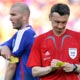 Referee Ivanov of Russia takes down the name of Zidane after showing the latter a yellow card