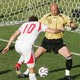 Daniel Gygax heads a ball against Fabien Barthez