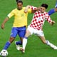 Ronaldinho battles for the ball with Srna during their Group F World Cup 2006 soccer match in Berlin