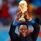 Pele holds the World Cup trophy