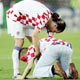 Fan kneels in front of Prso during the Group F World Cup 2006 soccer match against Brazil