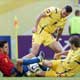 Xavi fights for the ball with Shevchenko and Shelayev during their Group H World Cup 2006 soccer match in Leipzig