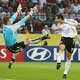 Miroslav Klose attempts a header at goal against Artur Boruc