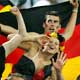 Germany fans celebrate after Germany beat Poland in their Group A World Cup 2006 soccer match in Dortmund