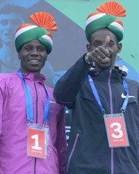 Second-placed runner Seboka Dibaba, (L), winner Gideon Kipketer (C) and third-placed Marius Kimutai