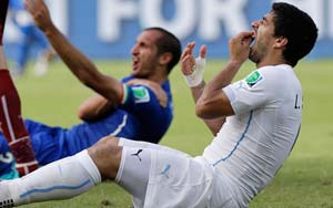 Suarez banned for nine matches and four months over biting incident (Lead)