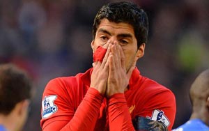 Suarez apologises, vows to never bite again