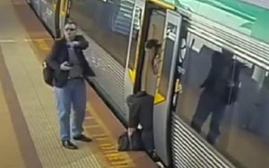 Perth commuters lift train to free trapped passenger