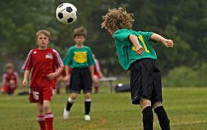 Neuroscientist warns heading footballs not safe for kids