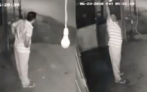 Watch - Man steals bulb while exercising; fails to spot CCTV camera