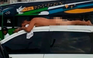 Vengeful wife parades her naked cheating husband atop her vehicle