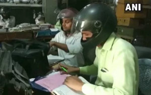 Indian Office Workers Wear Bike Helmets to Work to Prevent Head Injuries