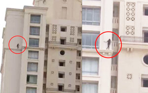 Terrifying Video Of A Girl Walking On The Ledge Of High-Rise Apartment Goes Viral
