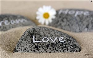 Love, hope and dream painted on stones