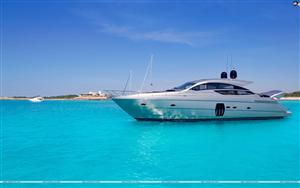 Luxury yacht in turquoise beach of Formentera Illetes, near Ibiza at Balearic Islands of Spain