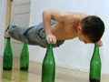 Kid Push Ups on Glass Bottles