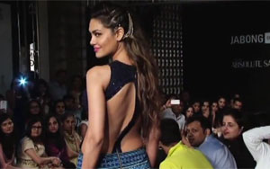 Beautiful Esha Gupta walks the ramp for Neha Agarwal at Lakme Fashion Week 2014 and gives an exclusive interview to Lehren. She looks stunning in a backless designer dress. Check her out but also listen to what she says.