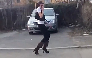 A Girl Struggles to Walk In High Heels