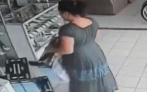 Woman Steals Plasma TV by stuffing it up her skirt