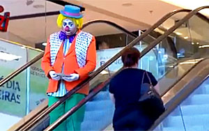 Clown Smashes pie in Woman's Face