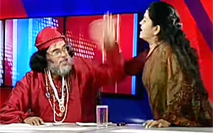 Lady Astrologer slaps Baba on a LIVE show 