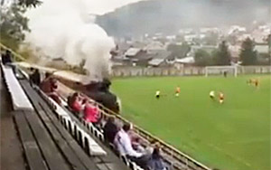 Train Drives Through Football Match