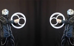 Give An Illusionist A Mirror For Crazy, Hypnotic Tricks In Double Vision