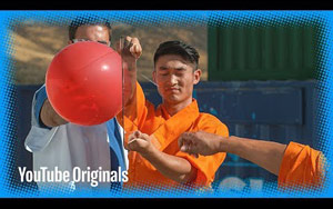 A Shaolin Monk Throwing a Needle Through Glass in Slow Motion